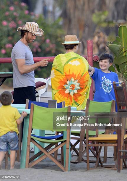 Part of this image has been pixellated to obscure the identity of the child). Sebastian Rulli and Angelique Boyer are seen on October 3, 2016 in...