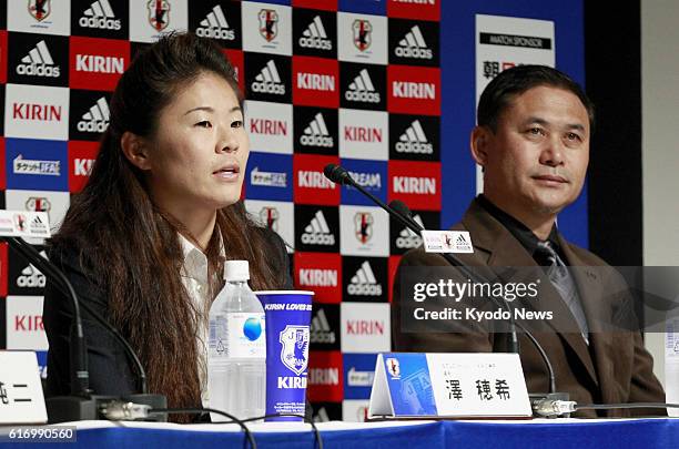 Japan - Homare Sawa , captain of the Japanese women's national soccer team, and coach Norio Sasaki attend a press conference in Tokyo on Jan. 11...