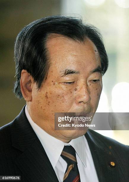 Japan - Defense Minister Yasuo Ichikawa heads for a Cabinet meeting at the prime minister's office in Tokyo on Jan. 13, 2012. Prime Minister...