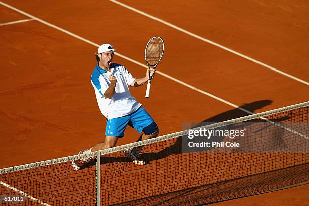Sebastien Grosjean of France celebrates on his way to beating Vincent Spadea of the USA in the mens singles during the third round of the French Open...