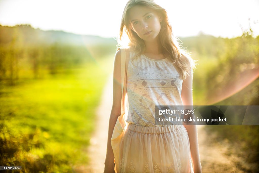 Daydreaming girl in the countryside.