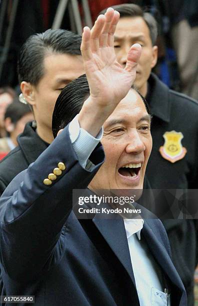 Taiwan - Taiwan President Ma Ying-jeou waves to his supporters after casting his vote in the island's presidential election in a polling station in...