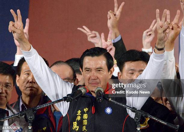 Taiwan - Taiwan President Ma Ying-jeou gestures victory to his supporters in front of the headquarters of his Nationalist Party in Taipei on the...