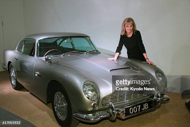 Brockenhurst, Britain - Britt Ekland, who appeared in the 1974 James Bond film ''The Man with the Golden Gun,'' poses beside an Aston Martin DB5 used...