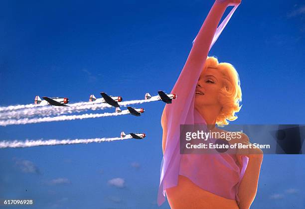 Composite image of a formation flying display and American actress Marilyn Monroe , photographed in Beverly Hills, California, at the end of June...