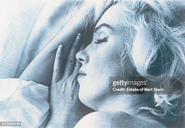 American actress Marilyn Monroe , photographed, apparently asleep, in Beverly Hills, California, at the end of June 1962. The two sessions for the...