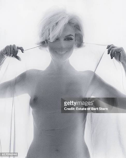 American actress Marilyn Monroe holding a sheer scarf, Beverly Hills, California, June 1962. The two sessions for the photoshoot took place in late...