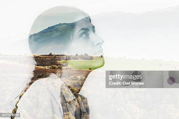 multiple exposure of a young woman and mountain landscape - fantasy portrait stock pictures, royalty-free photos & images