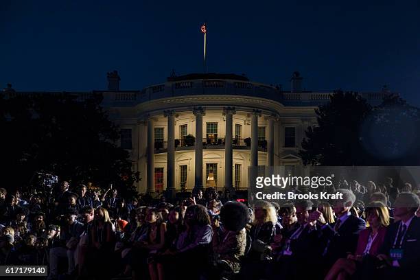 The audience listens as U.S. President Barack Obama, atmospheric scientist Katharine Hayhoe, and actor Leonardo DiCaprio participate in a...