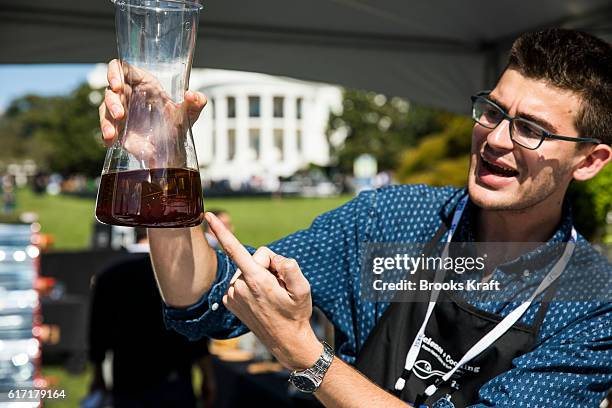 Vague Maini Rekhai from the Young Chefs Program shows off his salad dressing at the 'South By South Lawn', SXSL festival on October 3, 2016 in...