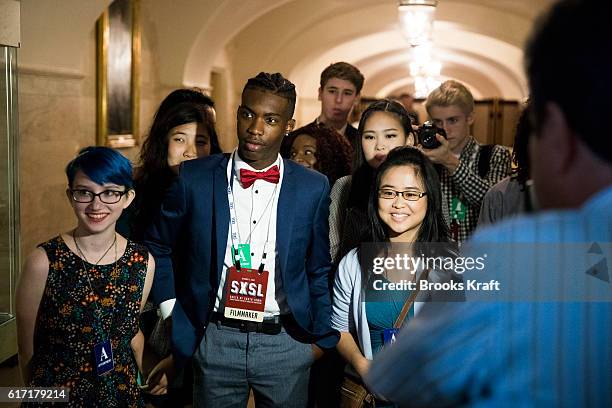 Visitors watch a musical performance inside the White House during the 'South By South Lawn', SXSL festival on October 3, 2016 in Washington, DC. The...