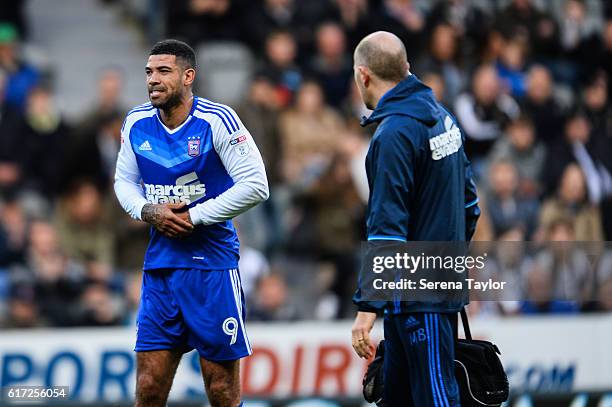 Leon Best of Ipswich Town seeks medical attention after hurting his hand during the Sky Bet Championship Match between Newcastle United and Ipswich...