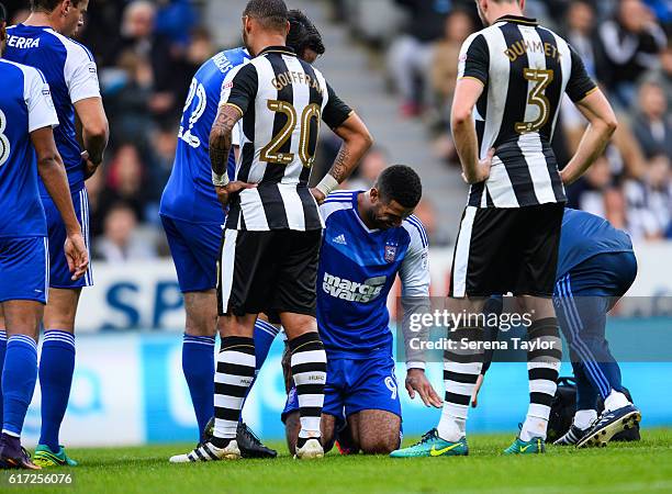 Leon Best of Ipswich Town seeks medical attention after hurting his hand during the Sky Bet Championship Match between Newcastle United and Ipswich...