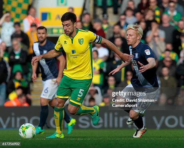 Norwich City's Russell Martin is chased down by Preston North End's Ben Pringle during the Sky Bet Championship match between Norwich City and...