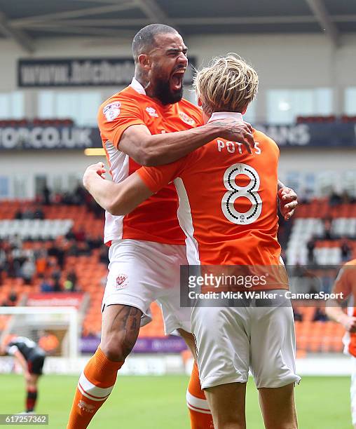 Blackpool's Brad Potts celebrates scoring his sides first goal with Kyle Vassell during the Sky Bet League Two match between Blackpool and Doncaster...