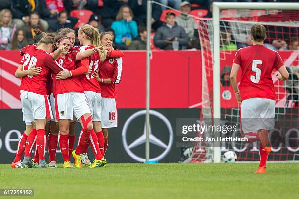 Players of the Austrian Team react after scoring a goal during the Women's International Friendly match between Germany and Austria at the...