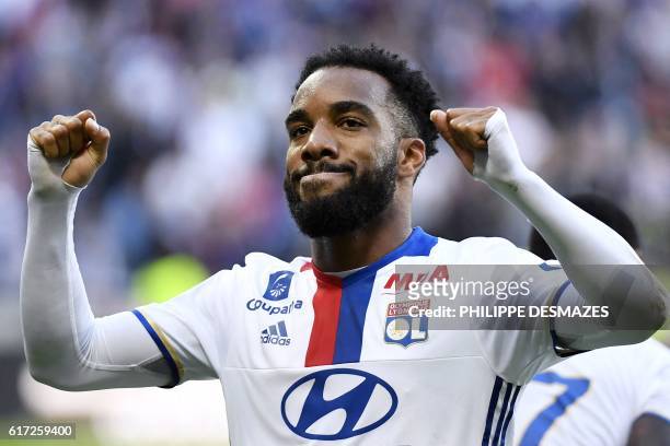Lyon's French forward Alexandre Lacazette reacts after scoring a goal during the French L1 football match between Olympique Lyonnais and EA Guingamp...