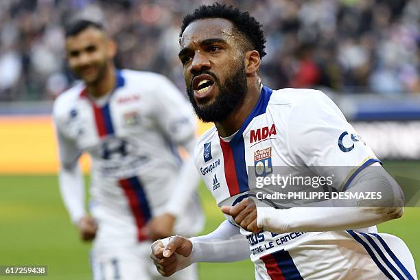 Lyon's French forward Alexandre Lacazette reacts after scoring a goal during the French L1 football match between Olympique Lyonnais and EA Guingamp...