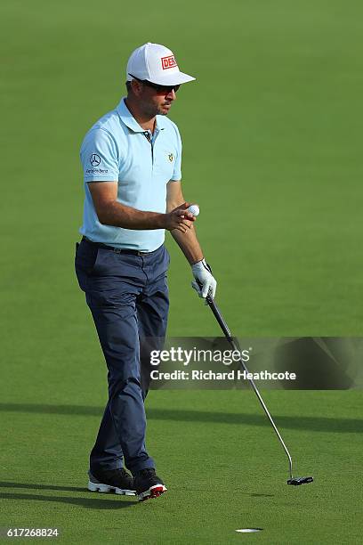 Mikko Korhonen of Finland reacts to a birdie on the 15th green during day three of the Portugal Masters at Victoria Clube de Golfe on October 22,...