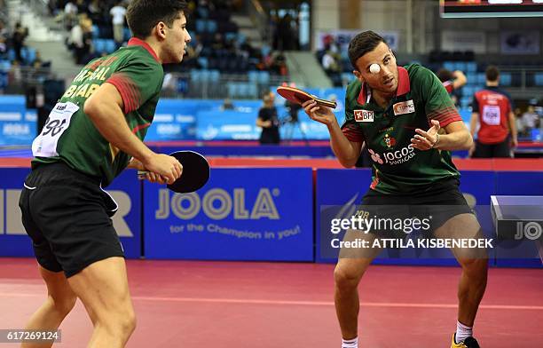 Portuguese Tiago Apolonia and Joao Geraldo vie against Polish Daniel Gorak and Jakub Dyjas in "Tuskecsarnok" sports hall of Budapest on October 22,...