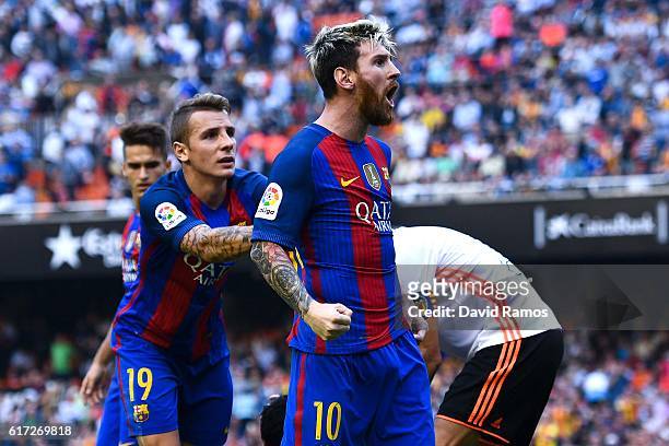 Lionel Messi of FC Barcelona celebrates with his team mates as Neymar Jr. And Luis Suarez reacts on the pitch after being hit by objects thrown from...