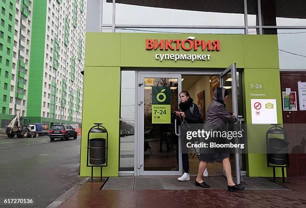 Customers leave a Victoria supermarket operated by Dixy Group PJSC in Moscow, Russia, on Friday, Oct. 21, 2016. The central bank has warned that its...