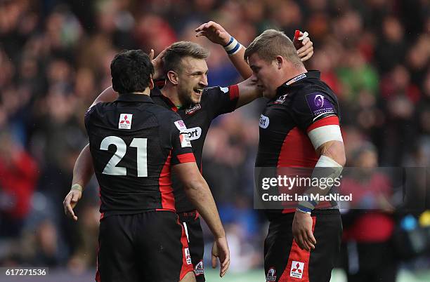 Sam Hidalgo-Clyne, Tom Brown and Murray McCallum of Edinburgh celebrate at full time during the European Rugby Challenge Cup match between Edinburgh...