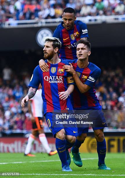Lionel Messi of FC Barcelona celebrates with his team mates Neymar Jr. And Denis Suarez after scoring his team's third from the penalty spot goal...