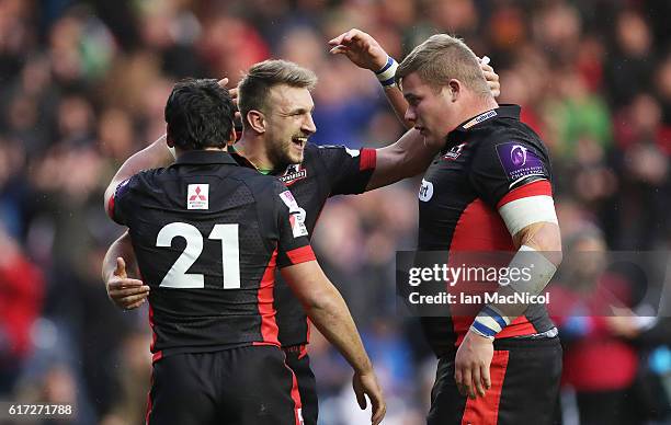 Sam Hidalgo-Clyne, Tom Brown and Murray McCallum of Edinburgh celebrate at full time during the European Rugby Challenge Cup match between Edinburgh...