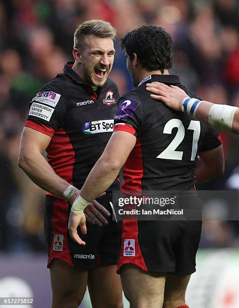 Sam Hidalgo-Clyne and Tom Brown of Edinburgh celebrate at full time during the European Rugby Challenge Cup match between Edinburgh and Harlequins at...