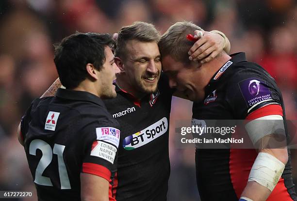 Sam Hidalgo-Clyne, Tom Brown and Murray McCallum of Edinburgh celebrate at full time during the European Rugby Challenge Cup match between Edinburgh...