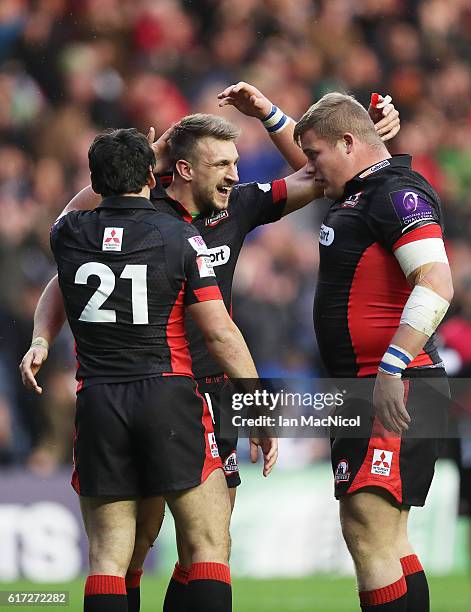 Sam Hidalgo-Clyne, Tom Brown and Murray McCallum of Edinburgh celebrate at full time during the European Rugby Challenge Cup match between Edinburgh...