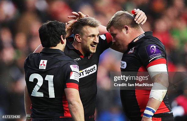 Sam Hidalgo-Clyne, Tom Brown and Murray McCallum of Edinburgh celebrate at full time during the European Rugby Challenge Cup match between Edinburgh...