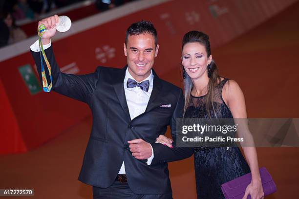 Paolo Pizzo and wife walk the red carpet during the film's premiere of 7 minuti at the 11th annual Rome Film Fest at Auditorium Parco Della Musica in...