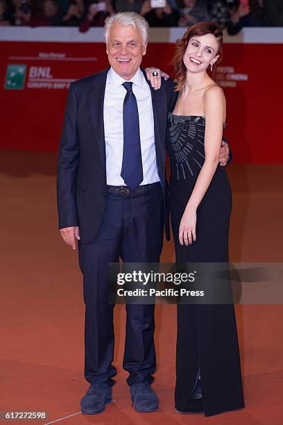 Italian director Michele Placido and producer Federica Vincenti walk the red carpet during the film's premiere of 7 minuti at the 11th annual Rome...