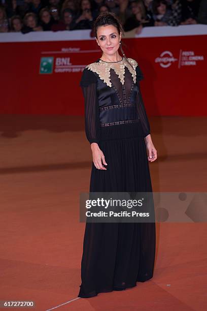 Italian actress Ambra Angiolini walks the red carpet during the film's premiere of 7 minuti at the 11th annual Rome Film Fest at Auditorium Parco...