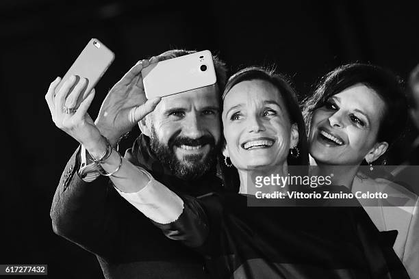 Ralph Fiennes, Kristin Scott Thomas and Juliette Binoche tak a selfie on the red carpet for 'The English Patient - Il Paziente Inglese' during the...