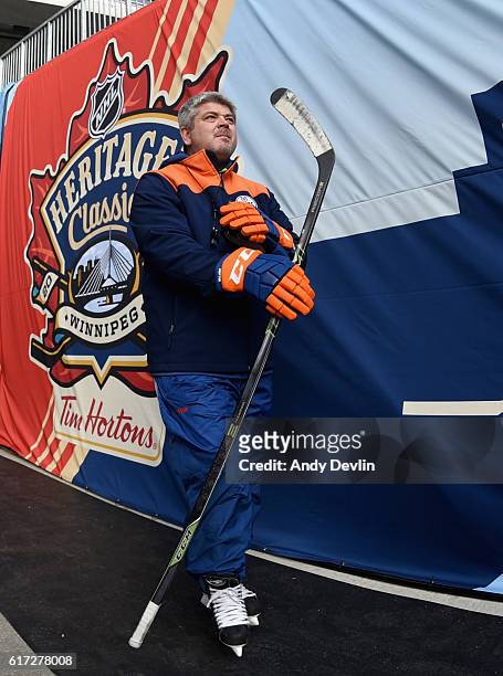 Head coach Todd McLellan of the Edmonton Oilers walks out to the field for practice in advance of the 2016 Tim Hortons NHL Heritage Classic at...