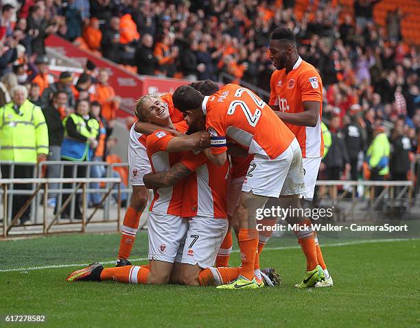 Blackpool's Kyle Vassell celebrates scoring his sides fourth goal with his team mates during the Sky Bet League Two match between Blackpool and...