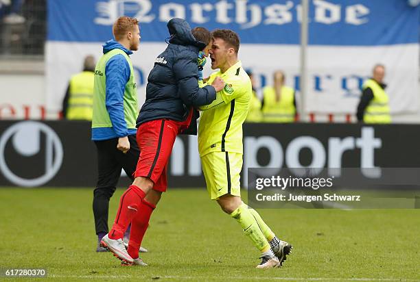 Goalkeeper Marcel Schuhen of Rostock celebrates with Marcel Ziemer after the third league match between MSV Duisburg and Hansa Rostock at...