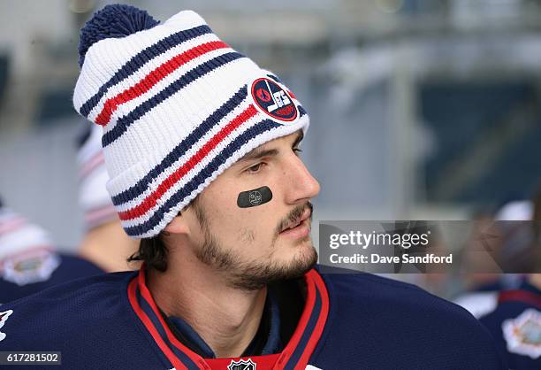 Goaltender Connor Hellebuyck of the Winnipeg Jets attends practice for the 2016 Tim Hortons NHL Heritage Classic at Investors Group Field on October...
