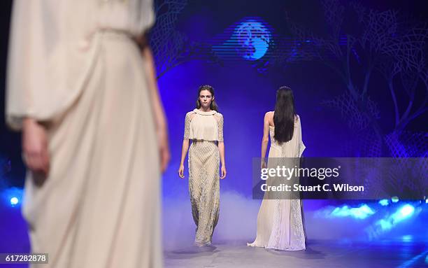 Model walks the runway during the Zareena show at Fashion Forward Spring/Summer 2017 held at the Dubai Design District on October 22, 2016 in Dubai,...