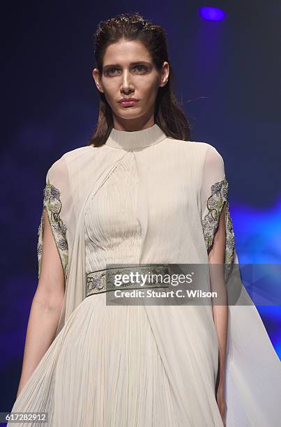 Model walks the runway during the Zareena show at Fashion Forward Spring/Summer 2017 held at the Dubai Design District on October 22, 2016 in Dubai,...