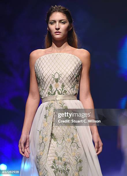 Model walks the runway during the Zareena show at Fashion Forward Spring/Summer 2017 held at the Dubai Design District on October 22, 2016 in Dubai,...