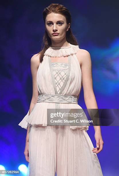 Model walks the runway during the Zareena show at Fashion Forward Spring/Summer 2017 held at the Dubai Design District on October 22, 2016 in Dubai,...