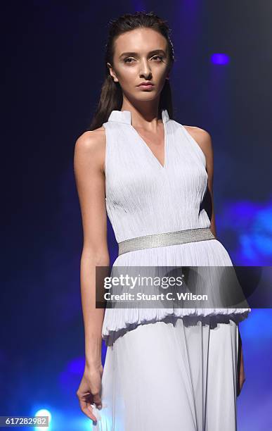 Model walks the runway during the Zareena show at Fashion Forward Spring/Summer 2017 held at the Dubai Design District on October 22, 2016 in Dubai,...