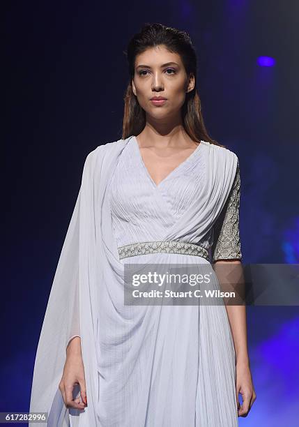 Model walks the runway during the Zareena show at Fashion Forward Spring/Summer 2017 held at the Dubai Design District on October 22, 2016 in Dubai,...