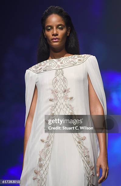 Model walks the runway during the Zareena show at Fashion Forward Spring/Summer 2017 held at the Dubai Design District on October 22, 2016 in Dubai,...