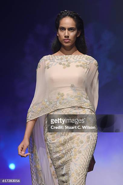 Model walks the runway during the Zareena show at Fashion Forward Spring/Summer 2017 held at the Dubai Design District on October 22, 2016 in Dubai,...