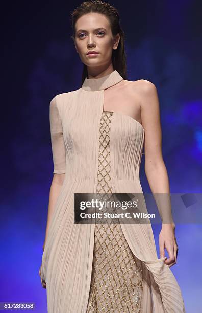 Model walks the runway during the Zareena show at Fashion Forward Spring/Summer 2017 held at the Dubai Design District on October 22, 2016 in Dubai,...